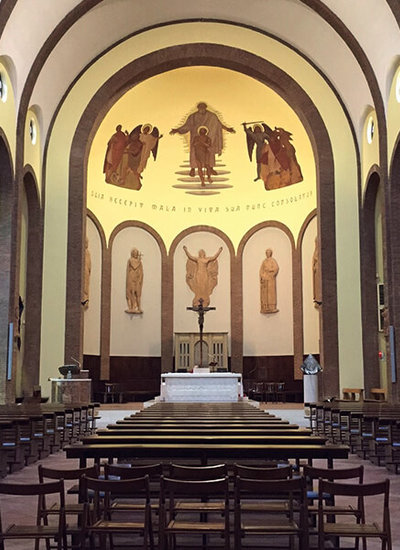 View through the nave of San Lazzaro Church in Italy with two Pan Beam line array speakers in columns design with Beam Steering.