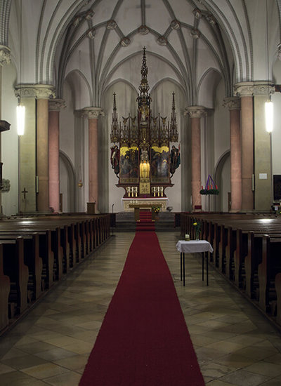 Church of Corpus Christi in Berlin with view from behind through the nave towards the altar.